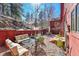 Backyard patio area with cozy seating and privacy fence at 23626 Genesee Village Rd, Golden, CO 80401