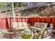 Backyard patio area with two seating areas separated by a privacy fence at 23626 Genesee Village Rd, Golden, CO 80401