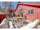 Backyard patio has a gravel floor, cozy seating, dining table and privacy fence at 23626 Genesee Village Rd, Golden, CO 80401