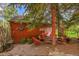 Relaxing backyard patio with comfortable seating, surrounded by trees, and a private atmosphere at 23626 Genesee Village Rd, Golden, CO 80401