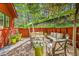 Cozy backyard patio featuring comfortable lounge seating, lush greenery, and a tranquil setting for outdoor enjoyment at 23626 Genesee Village Rd, Golden, CO 80401