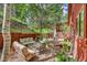 Spacious backyard patio with multiple seating areas, perfect for entertaining and relaxing in the outdoors at 23626 Genesee Village Rd, Golden, CO 80401