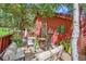Inviting backyard patio with comfortable seating and lush landscaping for outdoor relaxation and entertaining at 23626 Genesee Village Rd, Golden, CO 80401
