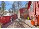 Backyard patio area with a dining table, privacy fence and rock floor at 23626 Genesee Village Rd, Golden, CO 80401