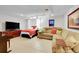 Open basement with sleeping and living space, light colored floor, and natural light from the window at 23626 Genesee Village Rd, Golden, CO 80401