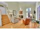 Bright living room with vaulted ceilings, hardwood floors, and a fireplace centerpiece at 23626 Genesee Village Rd, Golden, CO 80401
