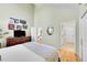 Bright main bedroom features vaulted ceiling, wood floors, ensuite bath and access to the hallway at 23626 Genesee Village Rd, Golden, CO 80401