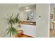 Cozy wet bar area with stylish cabinetry, a sink, and a decorative plant at 23626 Genesee Village Rd, Golden, CO 80401