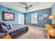 Well lit bedroom with large window, ceiling fan, closet and dresser at 240 Corby Pl, Castle Pines, CO 80108