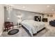 Finished basement bedroom with a decorative light fixture, carpet, and chair at 240 Corby Pl, Castle Pines, CO 80108