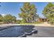 Community clubhouse surrounded by mature trees, bike racks, and a bench, enhancing the neighborhood's appeal at 240 Corby Pl, Castle Pines, CO 80108