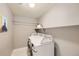 Functional laundry room with a shelf, washer, and dryer at 240 Corby Pl, Castle Pines, CO 80108