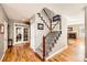 Entryway with hardwood floors, staircase, and glass paneled french doors at 240 Corby Pl, Castle Pines, CO 80108