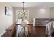 Inviting dining area with modern light fixture, bench seating, and hardwood flooring at 991 E Applewood Ave, Centennial, CO 80121