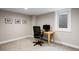 Well-lit home office features neutral walls, desk, and carpet, complete with a window and three framed pictures at 991 E Applewood Ave, Centennial, CO 80121