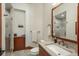 Bathroom featuring a stone counter top and vessel sink and a glass shower at 703 Emberglow Ln, Highlands Ranch, CO 80126
