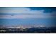 Panoramic city view at dusk with twinkling lights from the expansive cityscape at 703 Emberglow Ln, Highlands Ranch, CO 80126