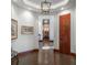 Inviting foyer featuring dark trim, fresh paint, and warm lighting at 703 Emberglow Ln, Highlands Ranch, CO 80126
