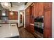 Beautiful kitchen boasts stainless steel appliances and plenty of custom wood cabinet space at 703 Emberglow Ln, Highlands Ranch, CO 80126