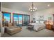 Spacious main bedroom featuring a balcony with city views and a cozy lounge area at 703 Emberglow Ln, Highlands Ranch, CO 80126