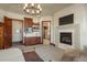 Main bedroom featuring a fireplace, a wet bar and access to the main bathroom and closet at 703 Emberglow Ln, Highlands Ranch, CO 80126