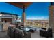 Relaxing patio with comfortable seating, fire pit and stunning panoramic views at 703 Emberglow Ln, Highlands Ranch, CO 80126