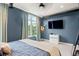 Bright bedroom featuring large windows and tasteful decor at 1242 Yates St # U2, Denver, CO 80204