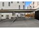 This home features a convenient covered carport with concrete flooring and adjacent access to the building's utilities at 1242 Yates St # U2, Denver, CO 80204