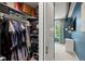 Spacious walk-in closet with ample storage space and access to the primary bedroom at 1242 Yates St # U2, Denver, CO 80204