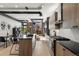 Modern kitchen featuring stainless steel appliances and a view to the outside patio area at 1242 Yates St # U2, Denver, CO 80204