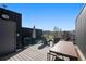 Spacious rooftop deck with lounge seating and city views, perfect for entertaining or relaxing outdoors at 1242 Yates St # U2, Denver, CO 80204
