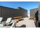 Stylish rooftop deck offering outdoor seating, dining, and entertaining spaces with skyline views at 1242 Yates St # U2, Denver, CO 80204
