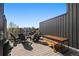 Relaxing rooftop deck offers lounge seating and table area for outdoor enjoyment at 1242 Yates St # U2, Denver, CO 80204