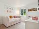 bedroom with bright, natural light, cute decor, and plush daybed at 7061 Palisade Dr, Highlands Ranch, CO 80130