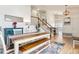 Bright dining room with hardwood floors and a stylish table setting, complemented by modern lighting at 7061 Palisade Dr, Highlands Ranch, CO 80130