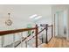 Bright foyer featuring a staircase with skylights, hardwood floors, and open layout at 7061 Palisade Dr, Highlands Ranch, CO 80130