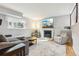 Cozy living room features a fireplace, large screen tv, and lots of seating at 7061 Palisade Dr, Highlands Ranch, CO 80130