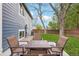 Patio with outdoor seating and lush green lawn at 7061 Palisade Dr, Highlands Ranch, CO 80130
