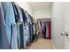Organized walk-in closet with clothing racks and ample storage for clothes and shoes at 7061 Palisade Dr, Highlands Ranch, CO 80130