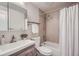 Clean bathroom with shower/tub combo, vanity, and toilet at 927 Quartz Ct, Longmont, CO 80504