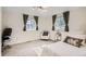 Bright bedroom with neutral carpeting and ample natural light at 927 Quartz Ct, Longmont, CO 80504