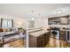 Updated kitchen with stainless steel appliances and island at 927 Quartz Ct, Longmont, CO 80504