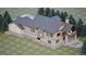Beautiful, multi-level house with many windows, a large deck, and a well-manicured lawn at 680 Lone Eagle Dr, Granby, CO 80015