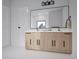Bathroom vanity featuring dual sinks, sleek hardware, and a minimalist design at 680 Lone Eagle Dr, Granby, CO 80015