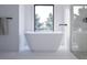 Stylish bathroom with a freestanding bathtub and modern hardware, plus a shower stall in the background at 680 Lone Eagle Dr, Granby, CO 80015