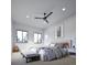 A serene bedroom with soft lighting, neutral décor, a ceiling fan, and a view from the windows at 680 Lone Eagle Dr, Granby, CO 80015