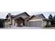 Striking two-story home featuring a three-car garage, stone accents, and craftsman-style details at 680 Lone Eagle Dr, Granby, CO 80015