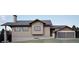 Charming home exterior featuring a blend of natural textures, warm wood siding, and a two-car garage at 680 Lone Eagle Dr, Granby, CO 80015