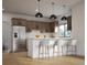 Modern kitchen featuring stainless steel appliances, wood cabinets, a breakfast bar, and hardwood floors at 680 Lone Eagle Dr, Granby, CO 80015