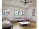 Spacious living room with lots of light, featuring contemporary sofas and elegant decor at 680 Lone Eagle Dr, Granby, CO 80015